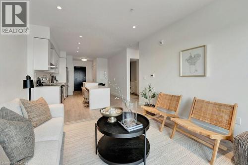 Living area featuring light wood-style flooring and recessed lighting - 15 Glebe Street Unit# 1511, Cambridge, ON - Indoor Photo Showing Living Room