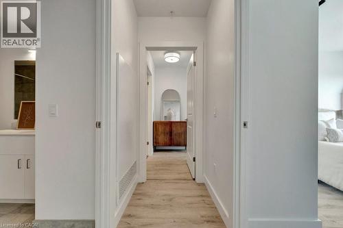 Hallway with light wood finished floors - 15 Glebe Street Unit# 1511, Cambridge, ON - Indoor Photo Showing Other Room