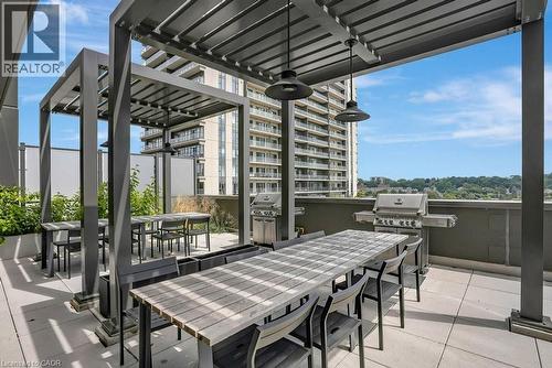View of patio / terrace featuring outdoor dining area and exterior kitchen - 15 Glebe Street Unit# 1511, Cambridge, ON - Outdoor With Deck Patio Veranda