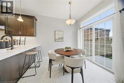 Dining room with light marble finish floors - 