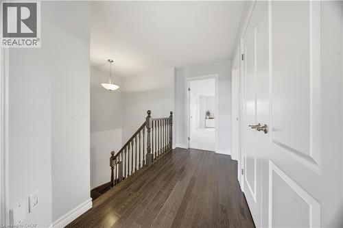 Hall featuring an upstairs landing and dark wood-style floors - 8 Summerberry Way, Hamilton, ON - Indoor Photo Showing Other Room