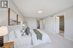 Bedroom featuring baseboards and carpet floors - 