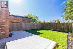Fenced backyard with a patio - 