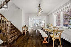Dining space featuring stairway and hardwood / wood-style flooring - 