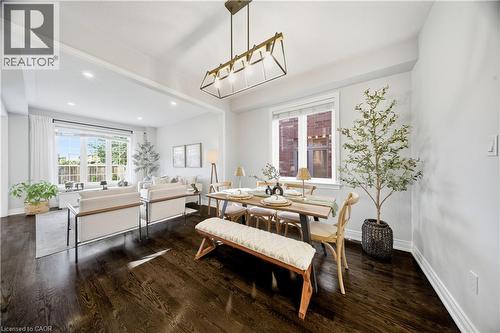 Dining space with dark wood-type flooring and recessed lighting - 8 Summerberry Way, Hamilton, ON - Indoor Photo Showing Dining Room