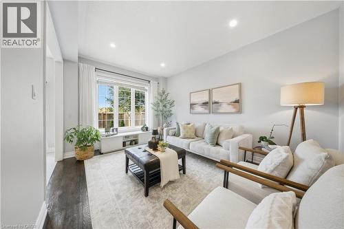 Living room with wood finished floors and recessed lighting - 8 Summerberry Way, Hamilton, ON - Indoor Photo Showing Living Room