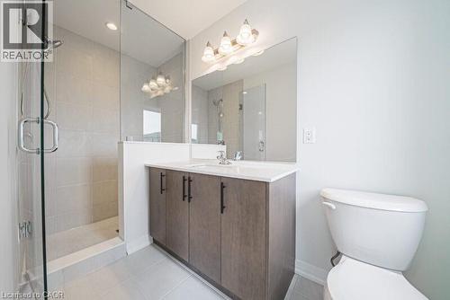 Bathroom with vanity, a stall shower, and light tile patterned floors - 155 Equestrian Way Unit# 22, Cambridge, ON - Indoor Photo Showing Bathroom
