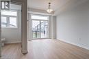 Unfurnished living room featuring light wood-style floors and baseboards - 155 Equestrian Way Unit# 22, Cambridge, ON  - Indoor Photo Showing Other Room 