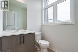 Bathroom with vanity and toilet - 