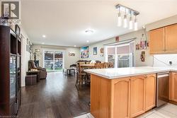 Kitchen featuring open floor plan, light countertops, a peninsula, and stainless steel dishwasher - 
