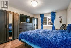 Bedroom with wood finished floors - 