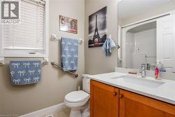Full bathroom with a shower, vanity, and light tile patterned floors - 