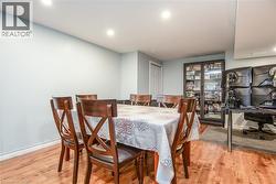 Dining space with light wood-style floors, recessed lighting, and an office area - 