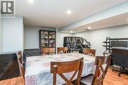 Dining area featuring light wood-style flooring and recessed lighting - 