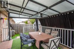 View of patio / terrace featuring outdoor dining area and an outdoor structure - 