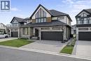 Contemporary home with stone siding, driveway, a shingled roof, and stucco siding - 972 Stonecliffe Walk Unit# 18, Kitchener, ON  - Outdoor With Facade 