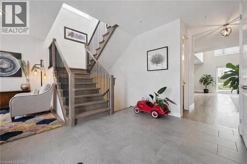 Staircase with tile patterned floors and baseboards - 972 Stonecliffe Walk Unit# 18, Kitchener, ON - Indoor Photo Showing Other Room