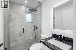 Full bath featuring vanity and a shower stall - 