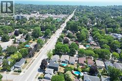 Aerial view of residential area featuring a nearby body of water - 