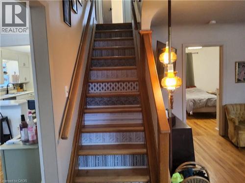 Stairway with wood finished floors - 509 Queensway W, Simcoe, ON - Indoor Photo Showing Other Room
