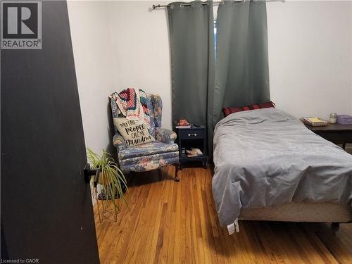 Main Floor Bedroom with wood-type flooring - 509 Queensway W, Simcoe, ON - Indoor Photo Showing Bedroom