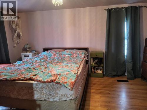 2nd floor Bedroom featuring wood finished floors - 509 Queensway W, Simcoe, ON - Indoor Photo Showing Bedroom