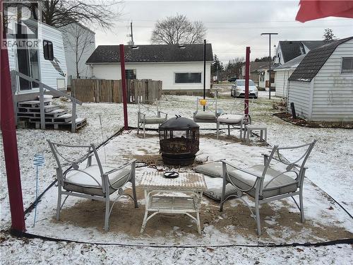 Fire pit in the back yard - 509 Queensway W, Simcoe, ON - Outdoor With Deck Patio Veranda