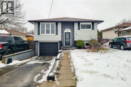 Raised ranch with brick siding, a garage, and driveway - 758 Stone Church Road E, Hamilton, ON - Outdoor