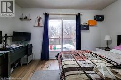 Bedroom with access to outside and light wood-type flooring - 