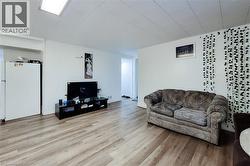 Living room with light wood-type flooring - 