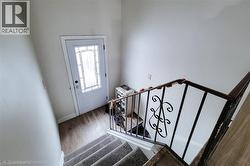 Entryway with stairway and wood finished floors - 