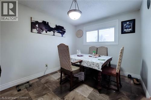 Dining room with a textured ceiling and baseboards - 758 Stone Church Road E, Hamilton, ON - Indoor Photo Showing Dining Room