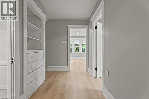 Hallway with light wood-style floors and baseboards - 88 Gage Avenue S, Hamilton, ON - Indoor Photo Showing Other Room