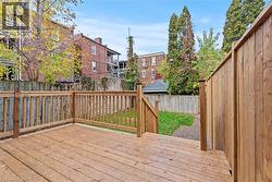 Wooden deck with a fenced backyard - 