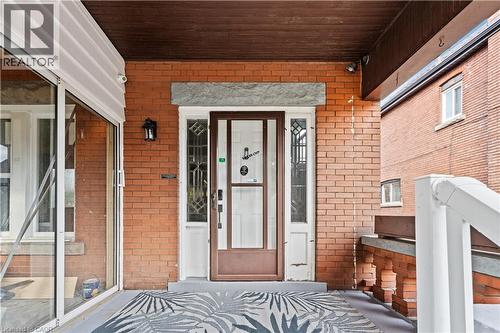 Property entrance with a porch and brick siding - 88 Gage Avenue S, Hamilton, ON - Outdoor With Exterior