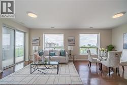 Living area featuring hardwood / wood-style flooring and a view of city - 