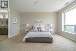 Bedroom featuring carpet and connected bathroom - 