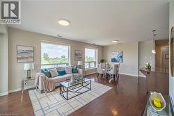 Living room featuring dark wood-type flooring - 