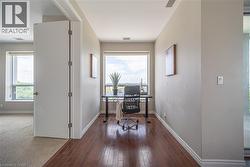Office space featuring baseboards and dark wood-style floors - 