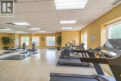 Exercise room featuring a drop ceiling - 
