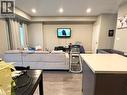 Living area with light wood-type flooring and recessed lighting - 65 Old School Trail Unit# 36, Welland, ON  - Indoor 
