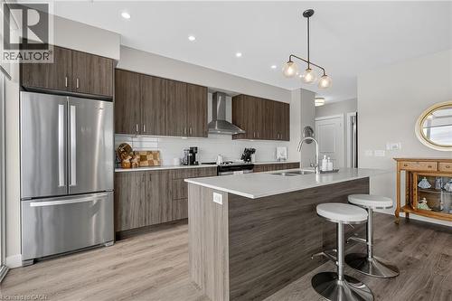 upgraded appliances and pendant lighting - 15 Glebe Street Unit# 1313, Cambridge, ON - Indoor Photo Showing Kitchen With Double Sink With Upgraded Kitchen