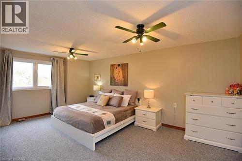 Carpeted bedroom featuring a textured ceiling and ceiling fan - 43 Niska Drive, Waterdown, ON - Indoor Photo Showing Bedroom