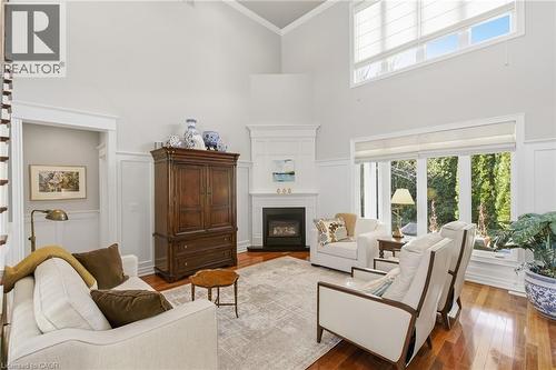 Main Floor Living room view of gardens - 643 King Street, Niagara-On-The-Lake, ON - Indoor Photo Showing Living Room With Fireplace