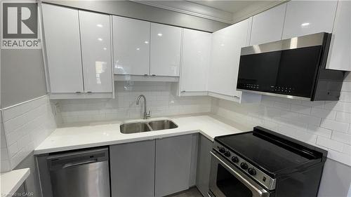 700 Lawrence Road Unit# 102, Hamilton, ON - Indoor Photo Showing Kitchen With Double Sink