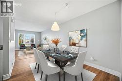 Dining room with wood finished floors and a textured ceiling - 