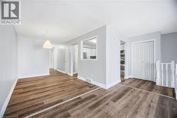 Empty room featuring baseboards and wood finished floors - 