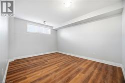 Empty room with wood finished floors and baseboards - 