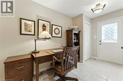 Currently in use as Office space featuring, seperate side entrance, bonus pantry, access to garage  and 2PC washrooom. - 