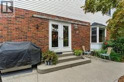 French doors, and a concrete patio area - 